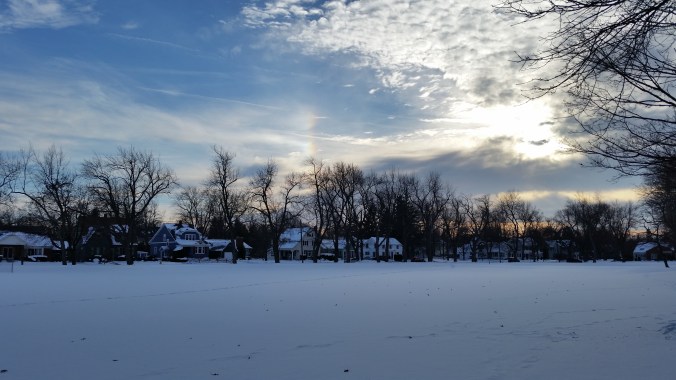A small rainbow in a dusky sky made my day!